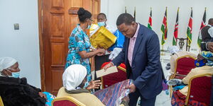 Machakos Governor Alfred Mutua suprises village women with gifts on Wednesday, July 14.
