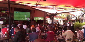 File image of Keyans watching a football match at a bar in Nairobi