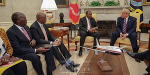 From left, Transport CS James Macharia, EAC CS Adan Mohamed, President Uhuru Kenyatta and US  president Donald Trump during a meeting in the United States on February 6, 2020.