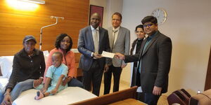 Ethan Macharia, his mother Veronica Njeri (pink), officials from the Kenyan Embassy in India and his doctors at the Forties hospital on Friday, February 28, 2020.