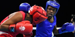 Cristine Ongare (blue) in a match during the 2018 Gold Coast Commonwealth Games. 