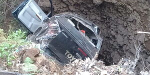 An image of A vehicle model of a Toyota Hilux that veered off the Meru-Maua road.