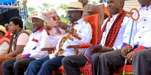 Raila Odinga (with newspaper)  with other leaders at the Narok BBI rally on Saturday, February 22, 2020