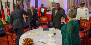 President Uhuru Kenyatta and first lady make a toast during a banquet at State House on Monday evening, February 25.