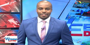 A photo of NTV News Anchor Edmond Nyabola on set.