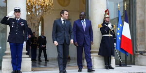 French President Emmanuel Macron (left) and President William Ruto (right) walk out of the Elysee Palace in Paris on Tuesday, January 24, during an official visit. 