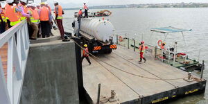 Engineers assess progress at the Kisumu Oil Jetty in February 2018.