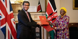 CS Betty Maina and Hon. Rahul barter the treaty agreement.