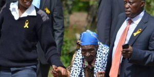 Mwai Kibaki's sister Esther Waitherero (centre) at the burial of Lucy Kibaki in Nyeri, 2016.