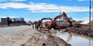 Excavators drill trenches along Mombasa Road on Sunday, November 28, 2021.