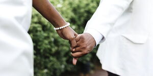 File image of a couple holding hands