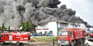 A picture showing firefighters are pictured at a storage yard in Mombasa on October 26, 2018. Fire broke out at a commercial building in Kitale on April 26, 2020.