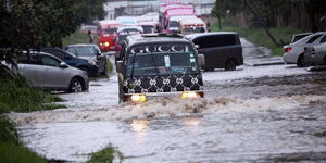 Motorists drive through the flooded Nyerere Avenue in Mombasa after heavy rains in May 2017.