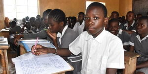 Form one student Adrian Momanyi in class at Rabour Primary School in Kisumu County, March 2023.