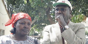 Former Gatundu North MP Patrick Muiruri and his wife at the Parklands police station.