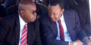 Undated image Former President Mwai Kibaki's son Jimmy (left) speaking to President Uhuru Kenyatta.