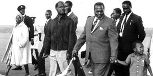 Former President Mzee Jomo Kenyatta (centre) with a young Uhuru Kenyatta, Vice President Moi (behind him) and former Attorney General Charles Njonjo (to Mzee Jomo's right) in the mid 1960s..jpg