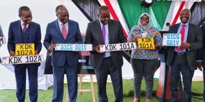 From left, ICT CS Joe Mucheru, Transport CS James Macharia and Interior CS Dr. Fred Matiangi (centre) during the commissioning of new generation number plates 