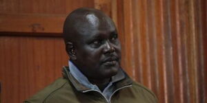 Former police officer and the main suspect in Lawyer Willie Kimani's murder Fredrick Lelliman stands at the dock during his sentencing on February 3, 2023.