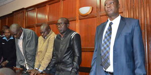 Right to left: Busia Governor Sospeter Ojaamong’, Bernard Yaite, Allan Omachari and Samuel Ombui at the Milimani Law Courts on July 6, 2018.