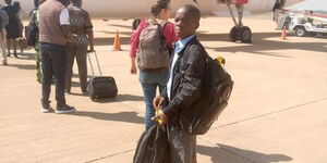 Top KCPE candidate Robinson Fwaro Makokha boarding plane as he heads to Alliance High School on Monday, February,6, 2023