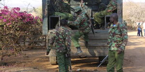 General Service Unit (GSU) officers boarding a patrol vehicle.