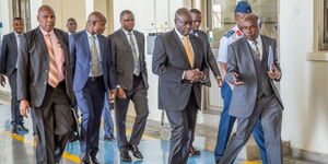 Deputy President Rigathi Gachagua (2nd from right) accompanied by other leaders on his way to board a plane to Rwanda on Thursday, October 13, 2022