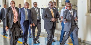Deputy President Rigathi Gachagua (second from right) on his way to board a plane to Rwanda on Thursday, October 13, 2022