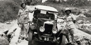 Galton Fenzi (left) and his Co-driver and the monument at Kenyatta Avenue.jpg