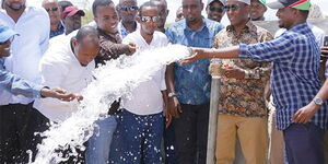 Garissa Governor Ali Korane (2nd right) commissions a water project on October 27, 2019