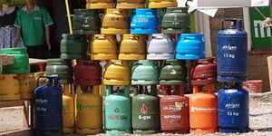Gas cylinders on display by a roadside.