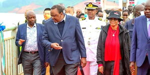 Gatundu North MP Wanjiku wa Kibe accompanies President Uhuru Kenyatta during the commissioning of the Karimenu II Dam in Gatundu on August 1. 2022