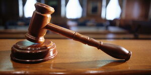 Undated file image of a gavel on the bench in the courtroom