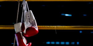 Gloves hanging in a boxing ring