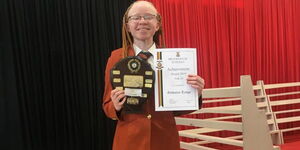Goldalyn Kakuya poses with an award at Brookhouse School