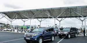 Government vehicles pictured at the JKIA exit area.