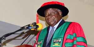 Former president, Mwai Kibaki, delivers a lecture at the Makerere University Main Hall on February 13, 2015.