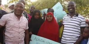 Hamdi Abikar Hassan (in red)with her teachers and other students at Alhuda Star Academy on March 28, 2022.