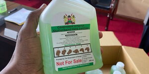 Chief of Staff Nzioka Waita shows new government hand sanitisers to be given for free to all counties.