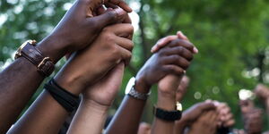 Hands holding each other during Black Lives Matter protests.