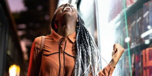 A stock image of a lady celebrating 