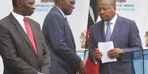  Government Spokesman Cyrus Oguna (left), Acting Ministry of Health Director-General Patrick Amoth (centre) and Health CS Mutahi Kagwe (right) during a press conference at the ministry’s headquarters in Nairobi on March 30, 2020.