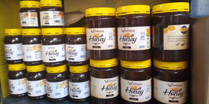 Honey produced by Bellafam Africa packaged in 250g and 500g containers.