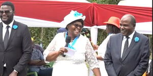 IEBC Chair Wafula Chebukati (right), his wife Mary and son Emmanuel