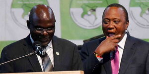 IEBC chairman Wafula Chebukati and President Uhuru Kenyatta at the IEBC National Tallying Centre at the Bomas of Kenya, Nairobi, August 11, 2017, when Uhuru was announced winner of the presidential election.jpg