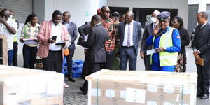 IEBC Commissioners inspecting the arrival of ballot papers at JKIA on July 7, 2022.