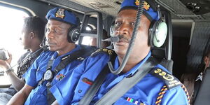 IG Hillary Mutyambai (right) and his deputy Edward Mbugua (centre) on a helicopter