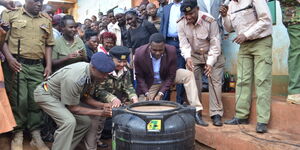 Tharaka-Nithi Governor Muthomi Njuki leading a multi-agency team in raiding illicit brew during a past operation.