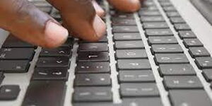 Image of fingers typing into a keyboard