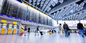 Individuals at an airport lobby